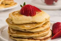 Fluffy Strawberry Pancakes with Fresh Berry Sauce