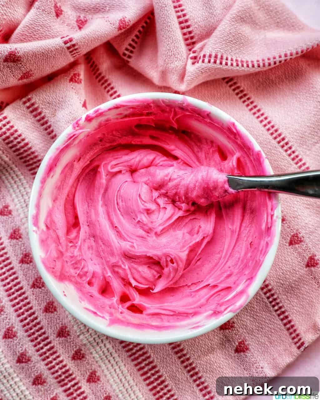 bowl of bright pink frosting.