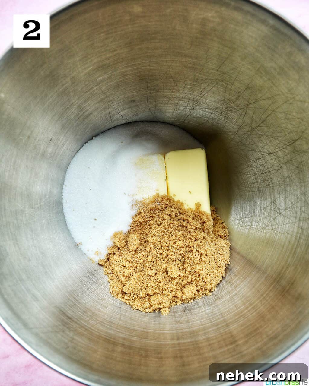butter and two sugars in a stand mixer bowl.