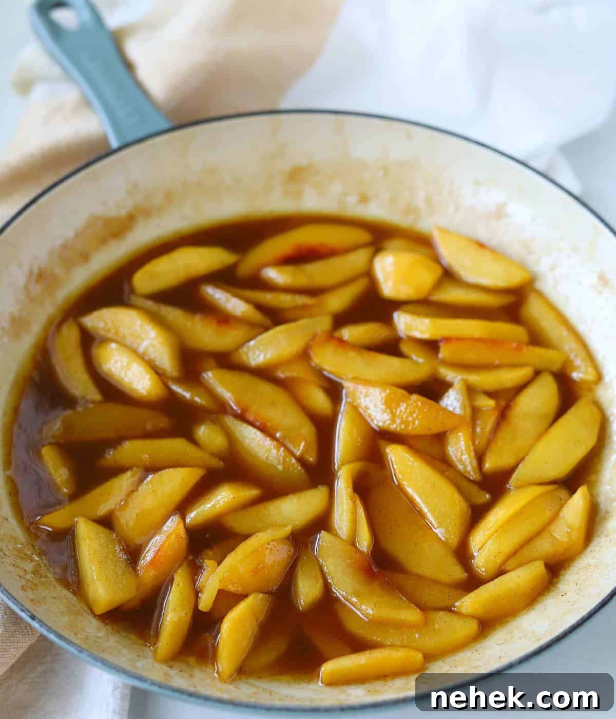 Skillet Caramelized Peaches with Brown Butter and Vanilla 8 Caramelized peaches in enameled skillet.