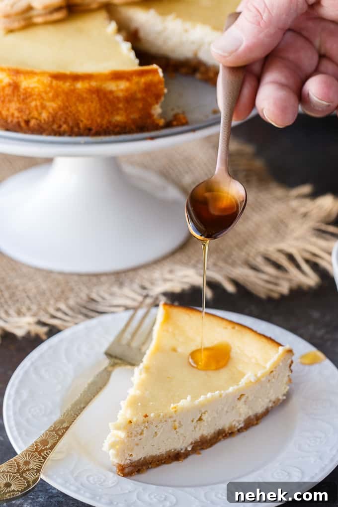 Decadent Maple Syrup Cheesecake Recipe with Brown-Butter Crust 6 Maple cheesecake slice with extra syrup.