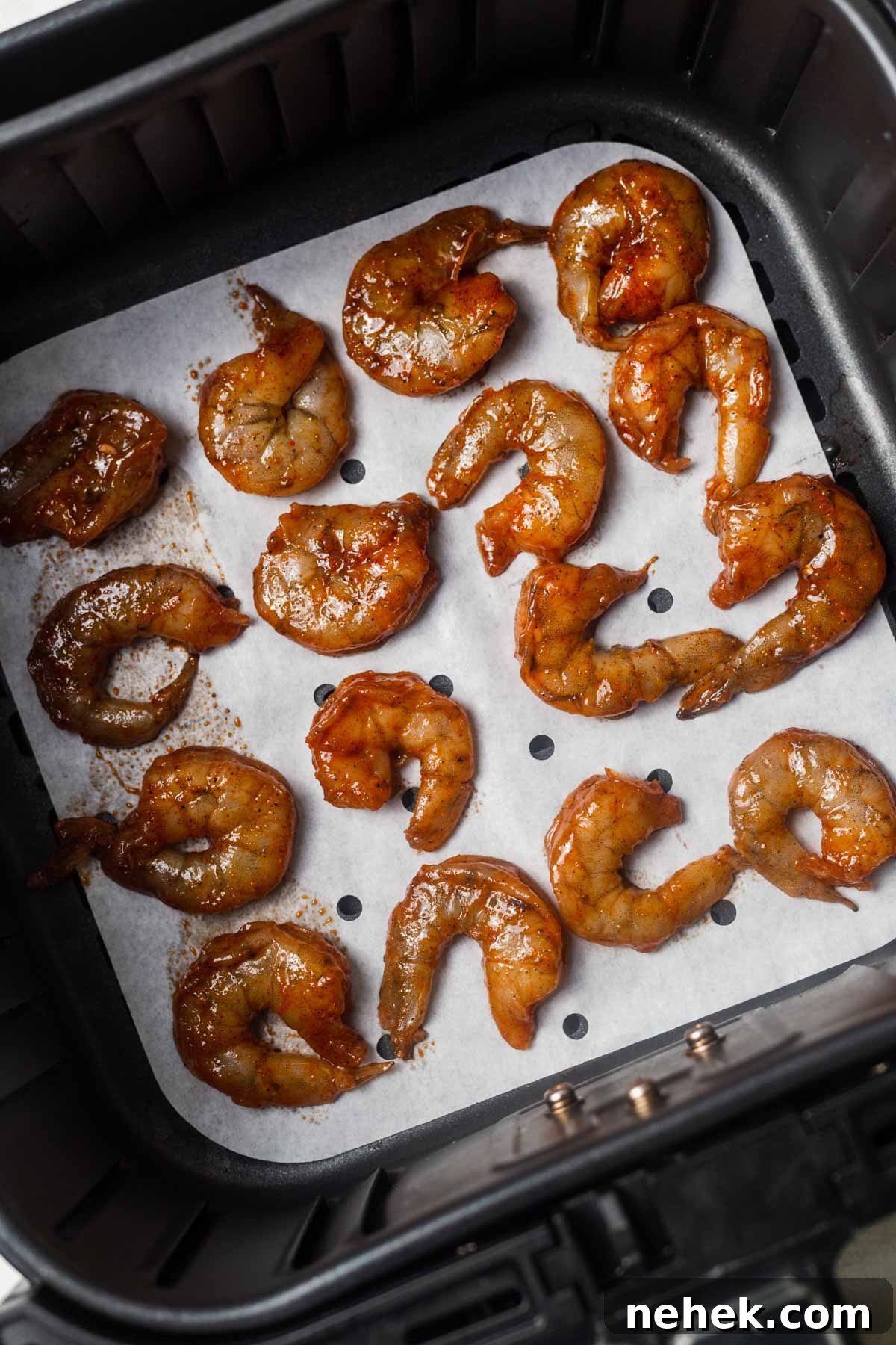 Crispy Air Fryer Shrimp Tacos with Lime Slaw 6 seasoned shrimp in the air fryer basket.