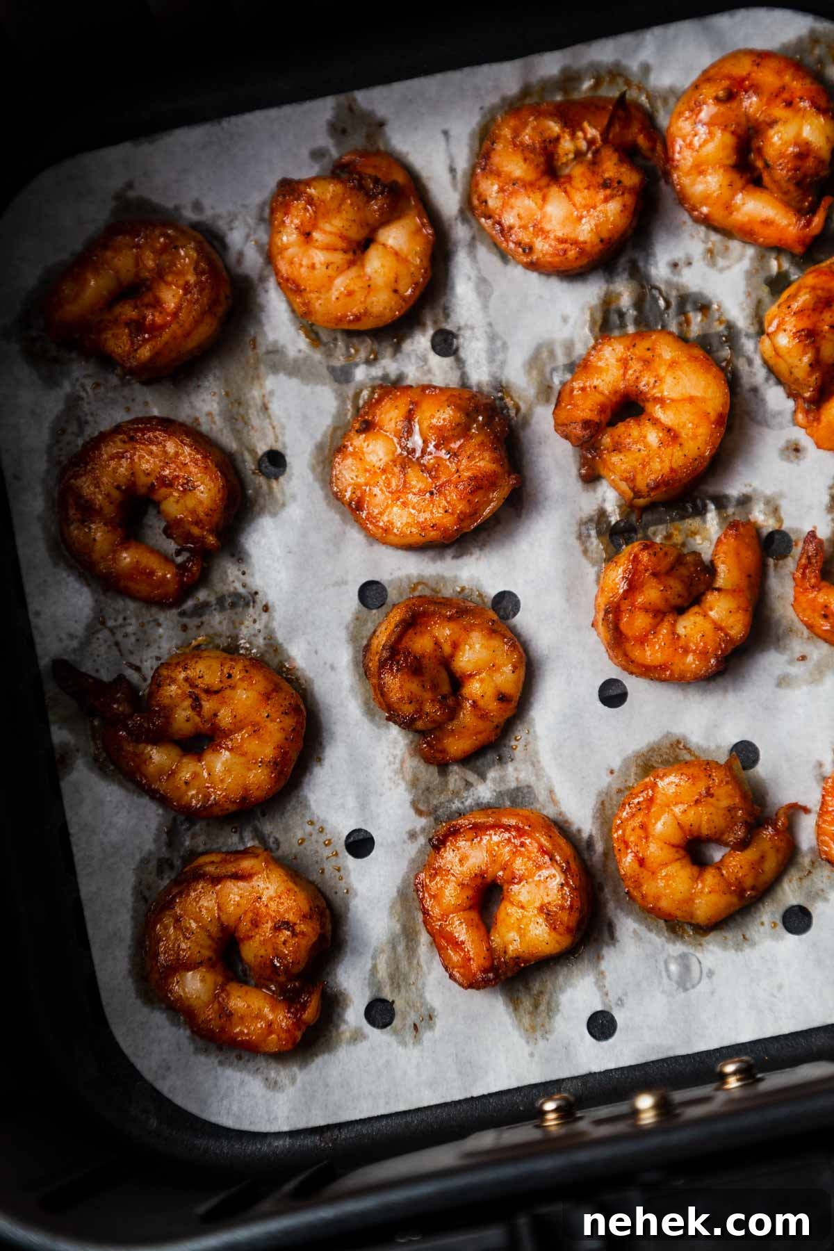 Crispy Air Fryer Shrimp Tacos with Lime Slaw 7 air fried shrimp in the air fryer basket.