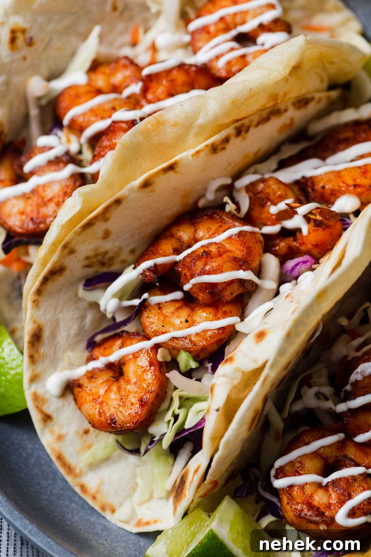 Crispy Air Fryer Shrimp Tacos with Lime Slaw 9 air fryer shrimp tacos in a plate.