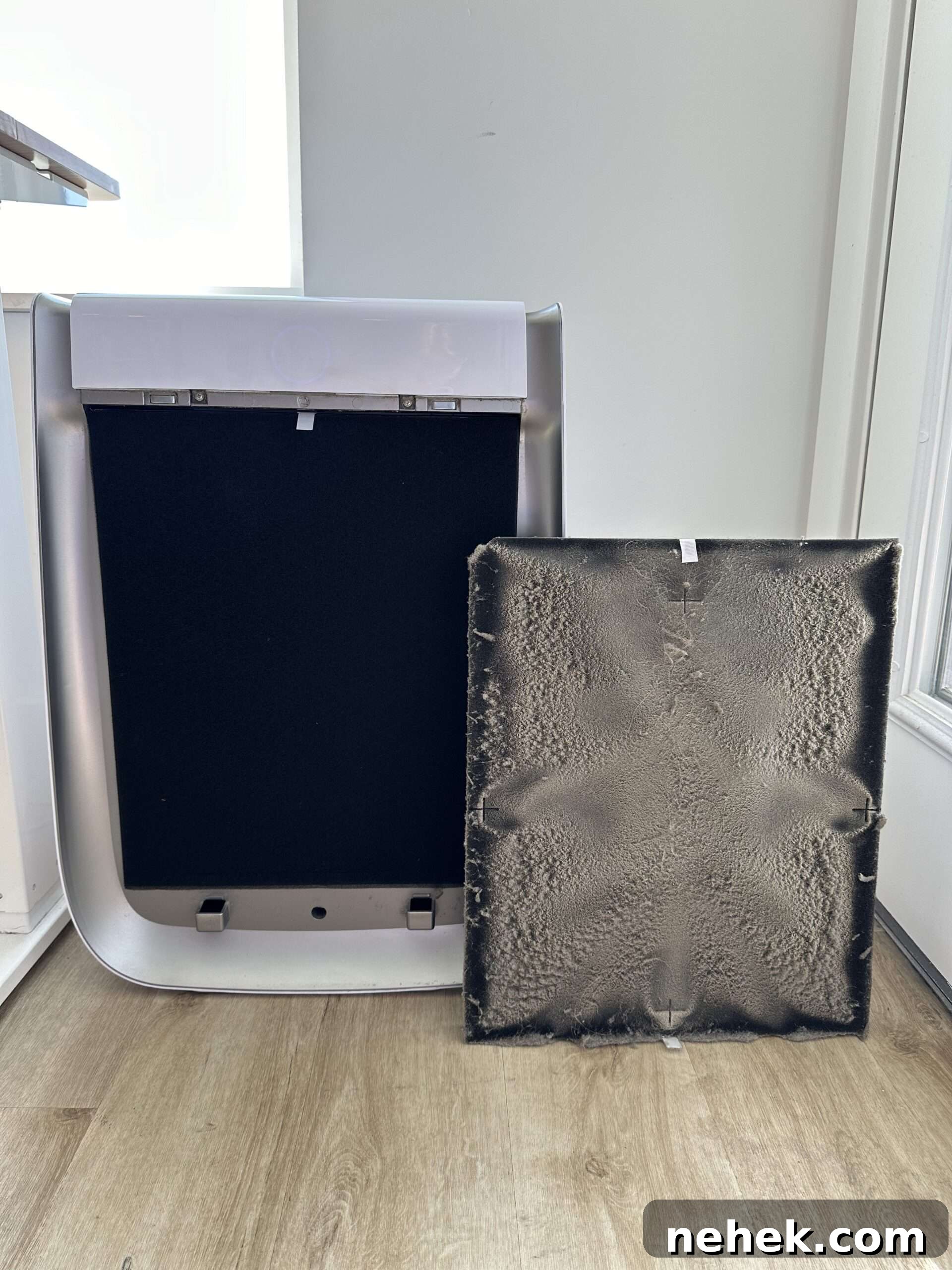 an image of the opened AirDoctor air filter where you can see the amount of dust it filters