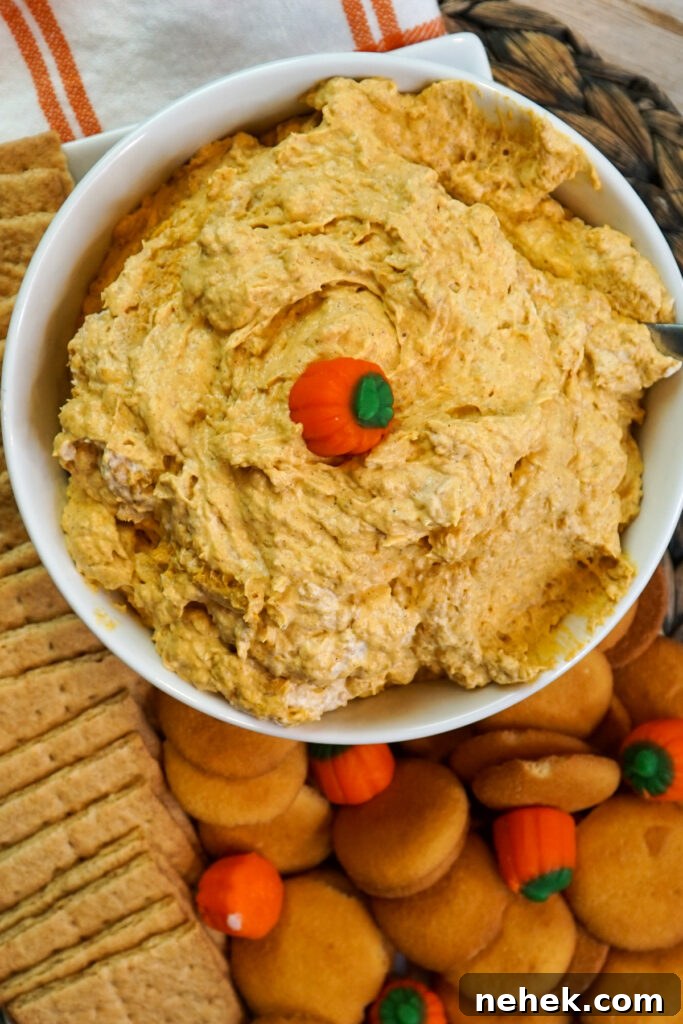 Close up of pumpkin fluff dip with a candy pumpkin in the middle of it.