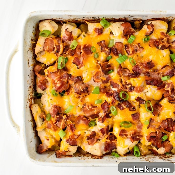 Chicken bacon ranch potato bake fresh from the oven in a rectangular dish.