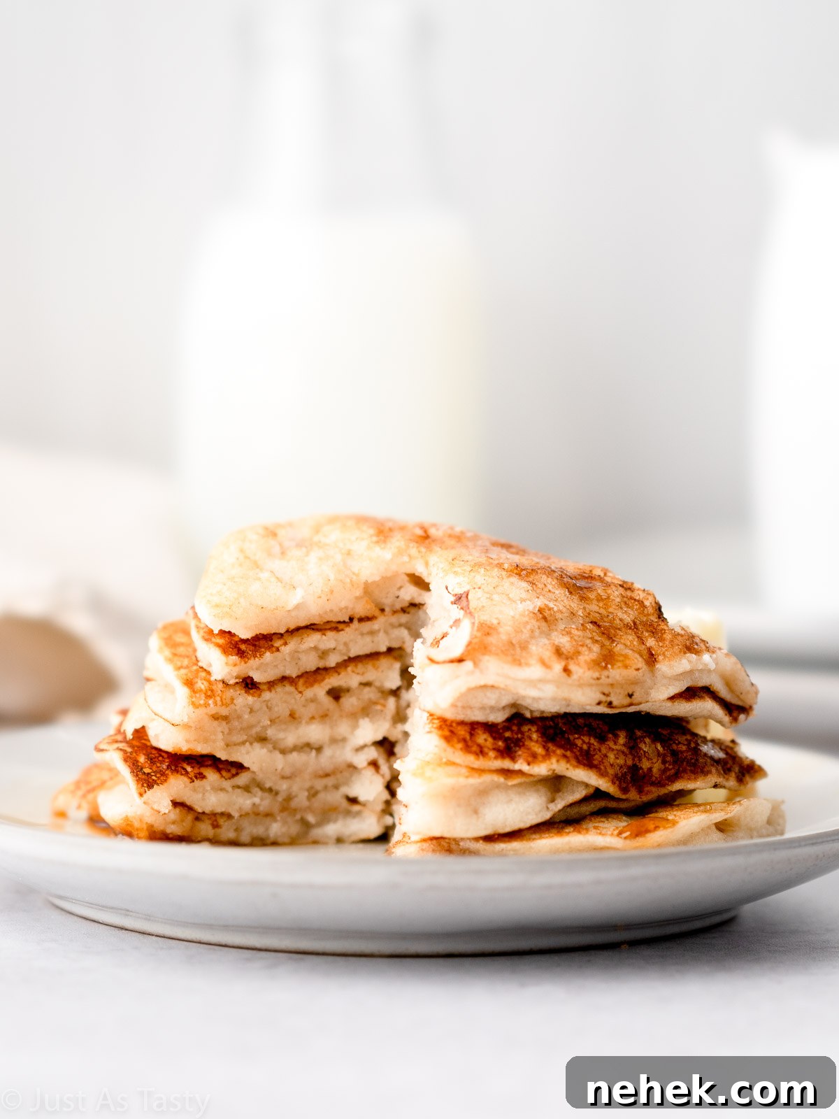 Stack of pancakes that have been cut into.