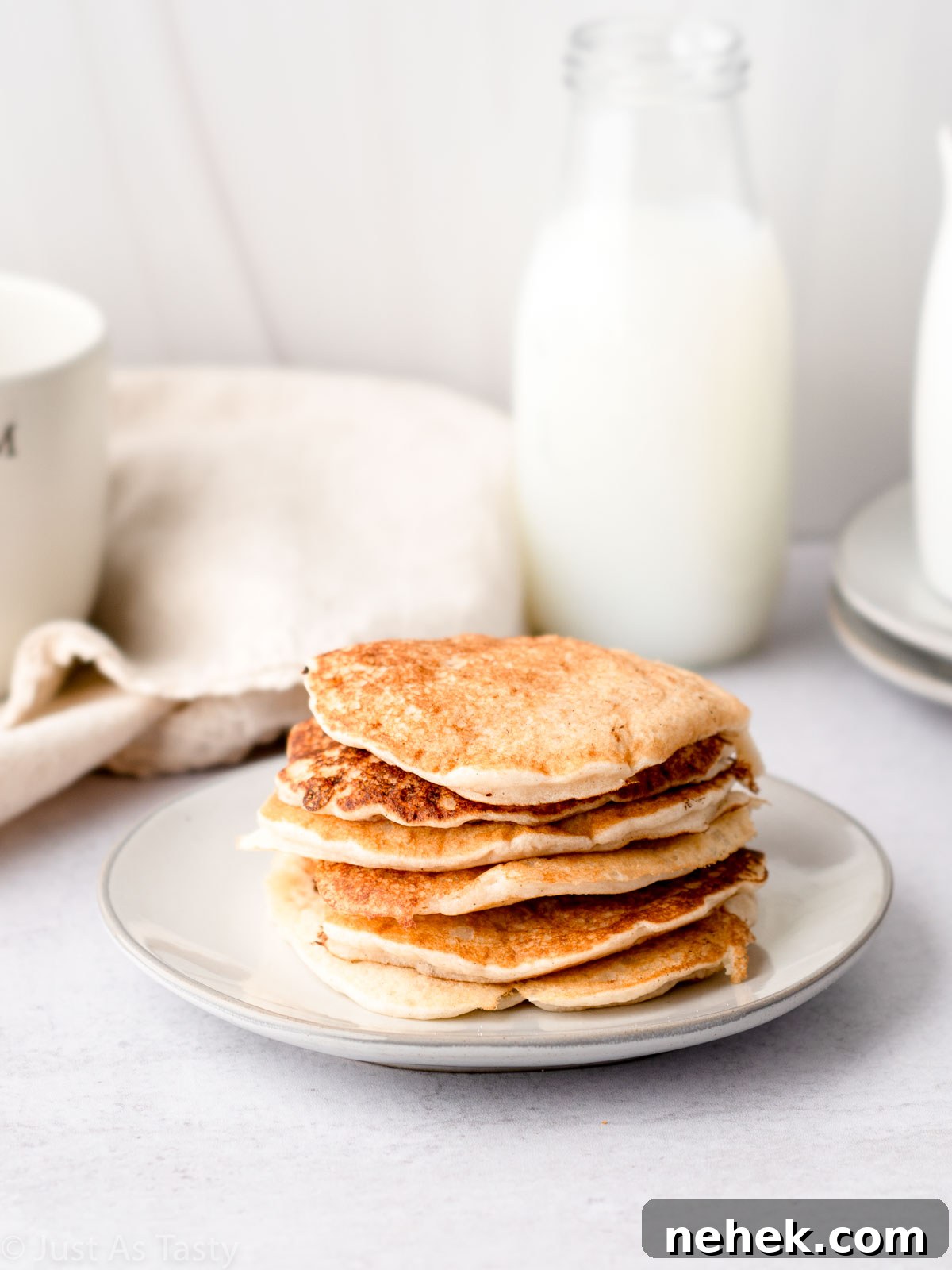 Stack of pancakes on a plate.