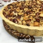 Honey Hazelnut pie served on marble board.