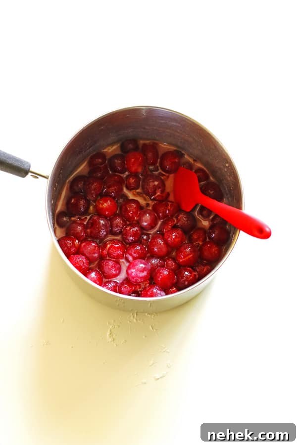 Classic Homemade Cherry Pie Recipe for Perfect Flaky Crust 5 Cherries coated in sugar in saucepan