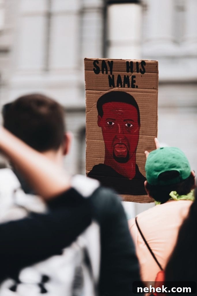 7 Practical Actions Individuals Can Take to Fight Racism 2 Placard with drawing of George Floyd