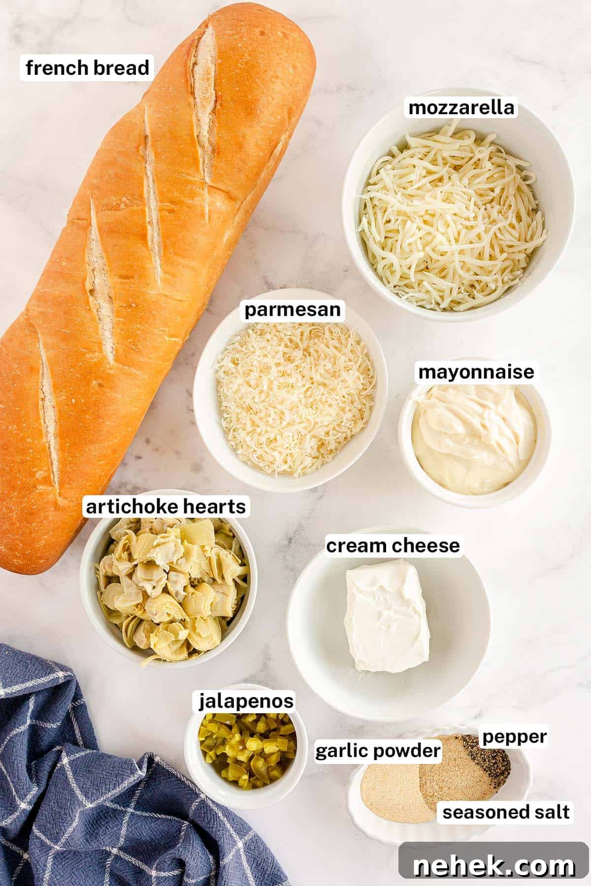 The ingredients for Cheesy Artichoke Bread with overlay text.