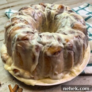 Pull-Apart Monkey Bread Recipe: Sticky Cinnamon Dinner Roll Pull-Aparts 4 Close up of monkey bread frosted with cream cheese frosting.