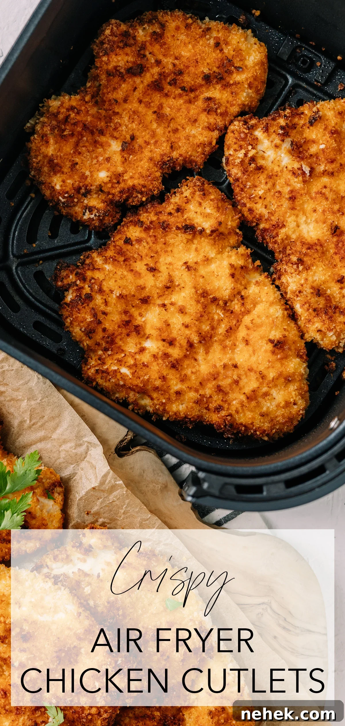 Top-down image of crispy, golden chicken cutlets in air fryer basket with title text overlay