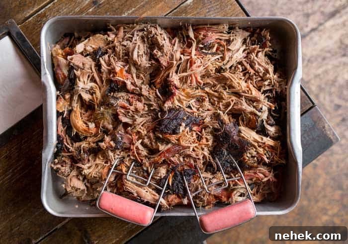shredded pork in large container
