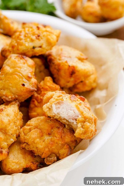 bite taken out of air fried popcorn chicken