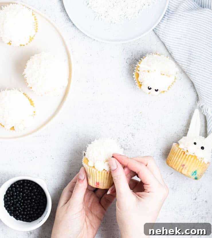 Adding black sprinkles to create eyes