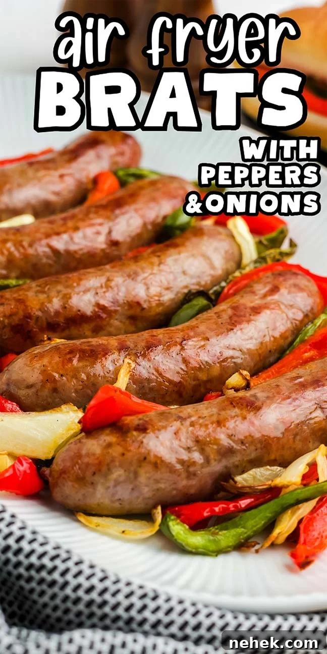 A plate of air fryer brats with peppers and onions, perfectly roasted. The text on the image reads: "Air Fryer Brats with Peppers & Onions.