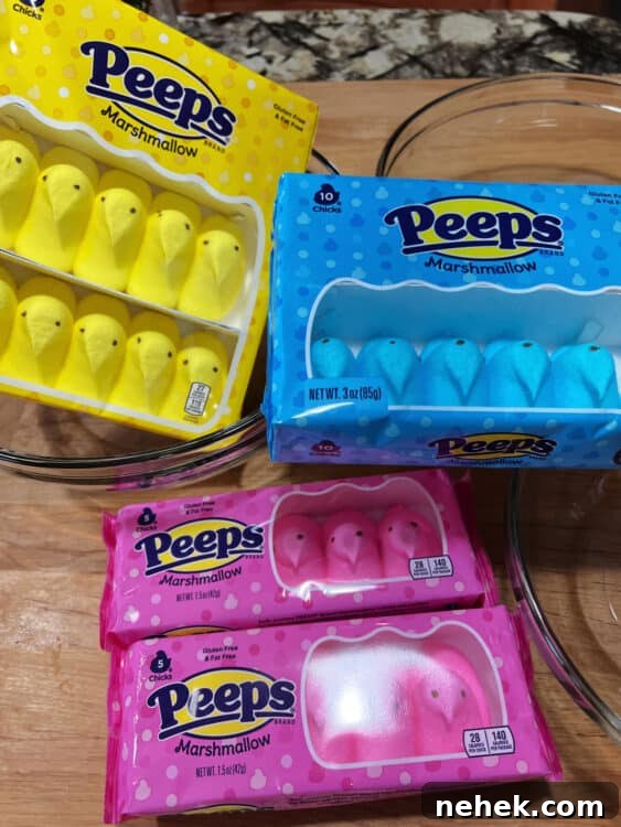 3 packages of Peeps, blue, pink, and yellow chicks