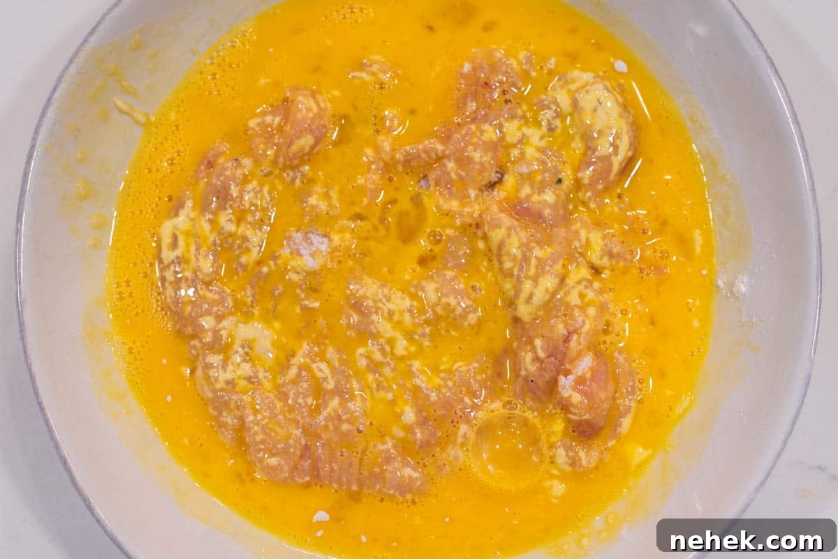Chicken dredged in eggs.