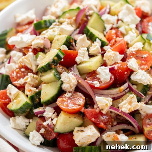 Cucumber tomato and feta salad in a bowl for serving.