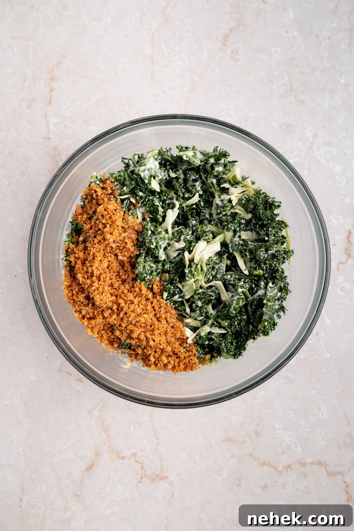 The dressed salad with the breadcrumbs on top.