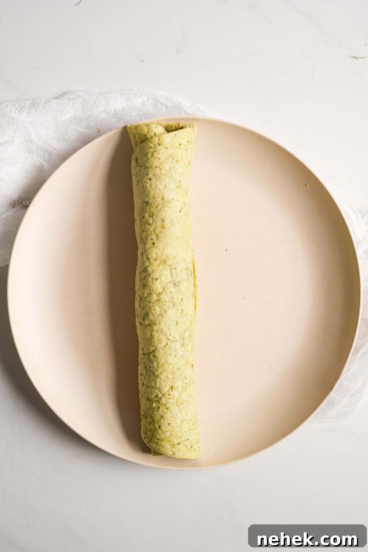 Crunchy Veggie Pinwheels with Cream Cheese and Herbs 9 one tortilla rolled up