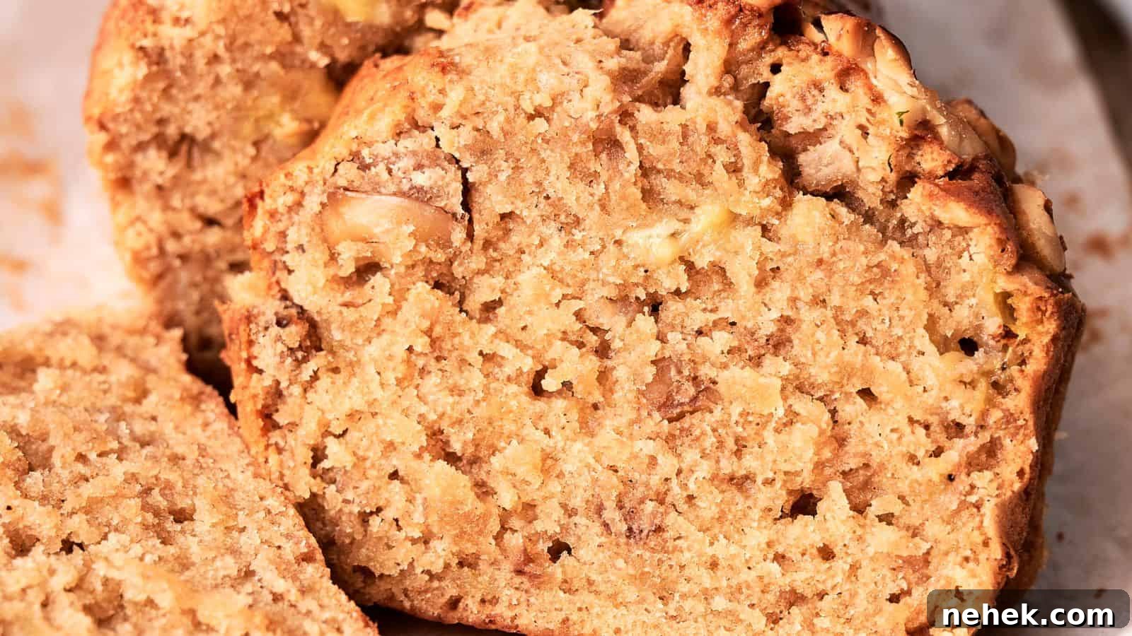 15 Delicious Easter Recipes to Make Your Celebration Shine 12 Close-up of a sliced banana bread loaf, showcasing its moist, textured interior with visible banana chunks.