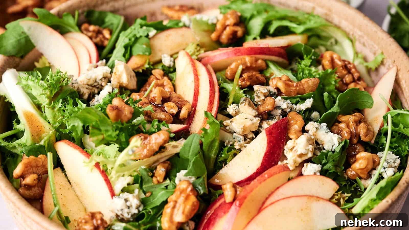 15 Delicious Easter Recipes to Make Your Celebration Shine 13 A bowl of mixed greens salad with sliced Honeycrisp apples, walnuts, and crumbled blue cheese.