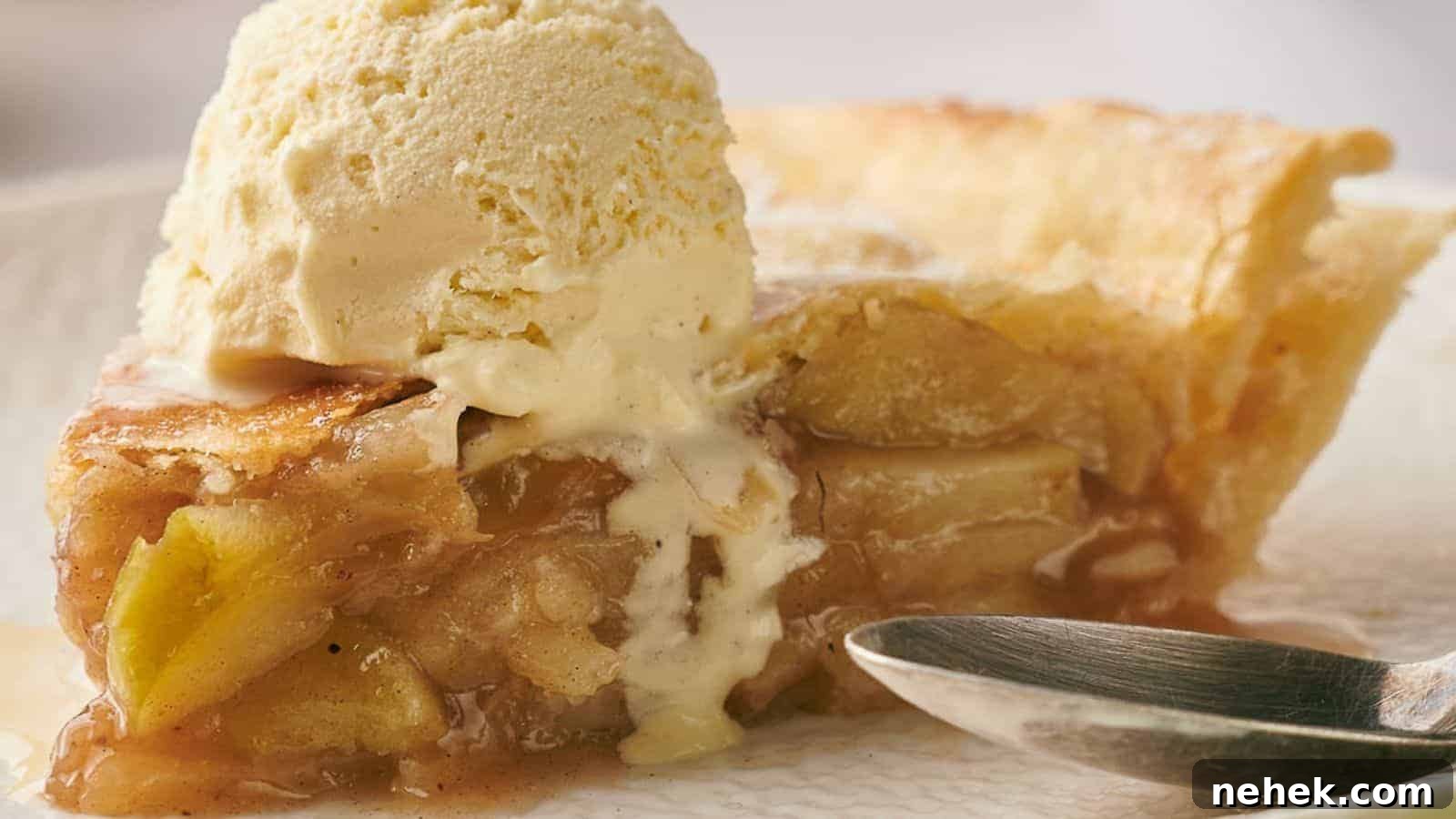 15 Delicious Easter Recipes to Make Your Celebration Shine 3 A slice of apple pie on a plate with a scoop of ice cream.