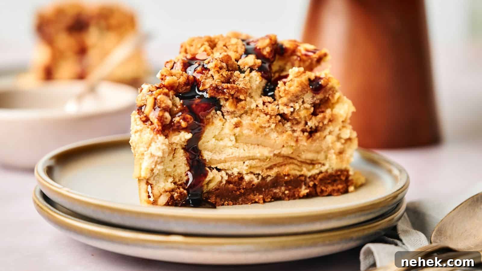 15 Delicious Easter Recipes to Make Your Celebration Shine 10 A slice of apple pie stuffed cheesecake on a plate with a spoon.