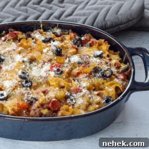 Low-Carb Pizza Casserole with Veggies and Mozzarella 13 healthy pizza casserole in a blue casserole dish with grey oven mitts in the background