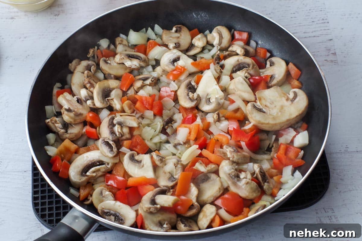 Low-Carb Pizza Casserole with Veggies and Mozzarella 4 Skillet with mushrooms, onions and peppers