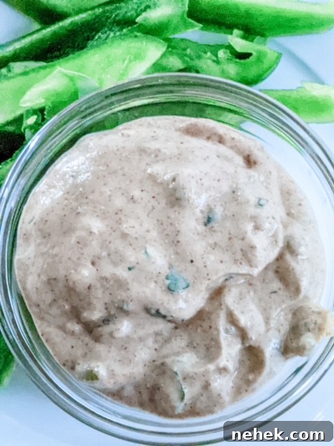 The Lighter Southwestern Buttermilk Ranch Dressing next to sliced green bell peppers.