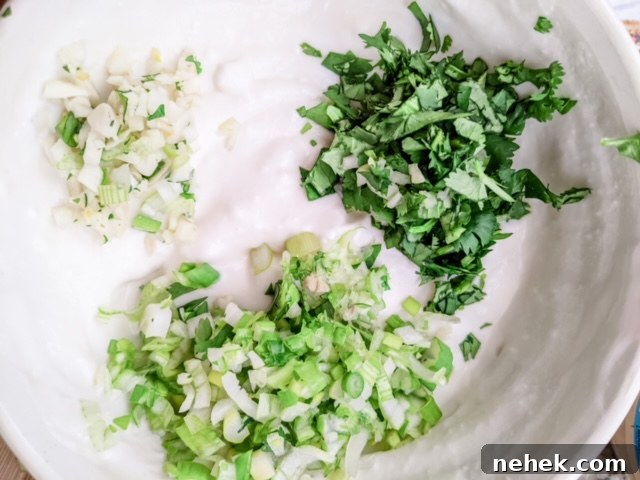 Chopped herbs in the dressing mixture.
