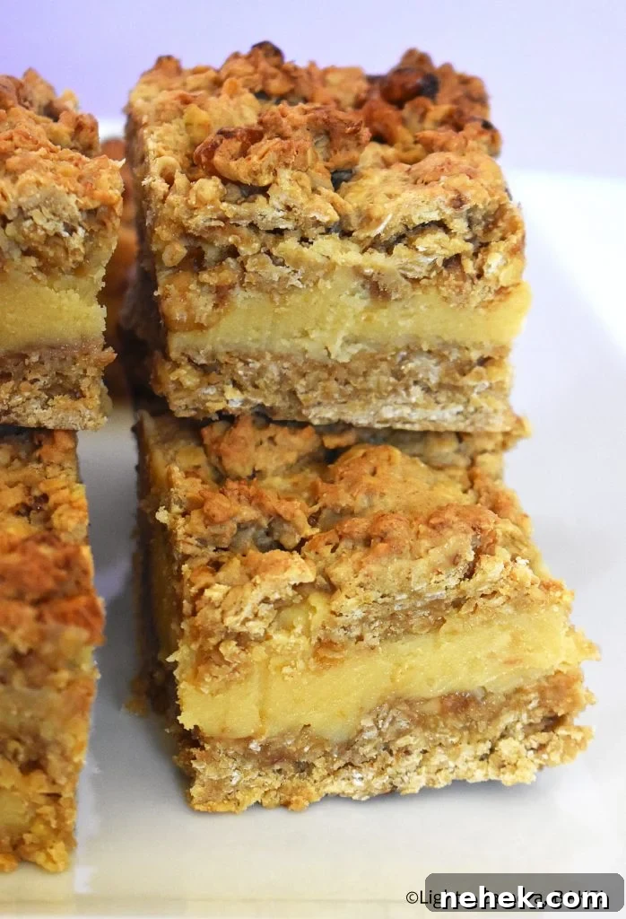Pieces of walnut caramel slice on a plate.