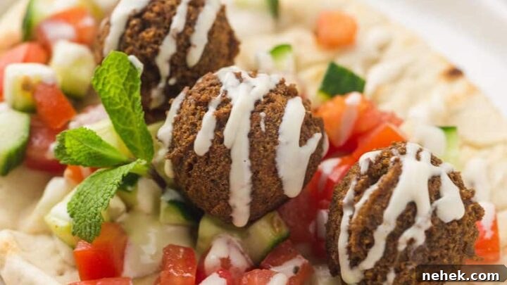 Three gluten-free falafels on a pita.
