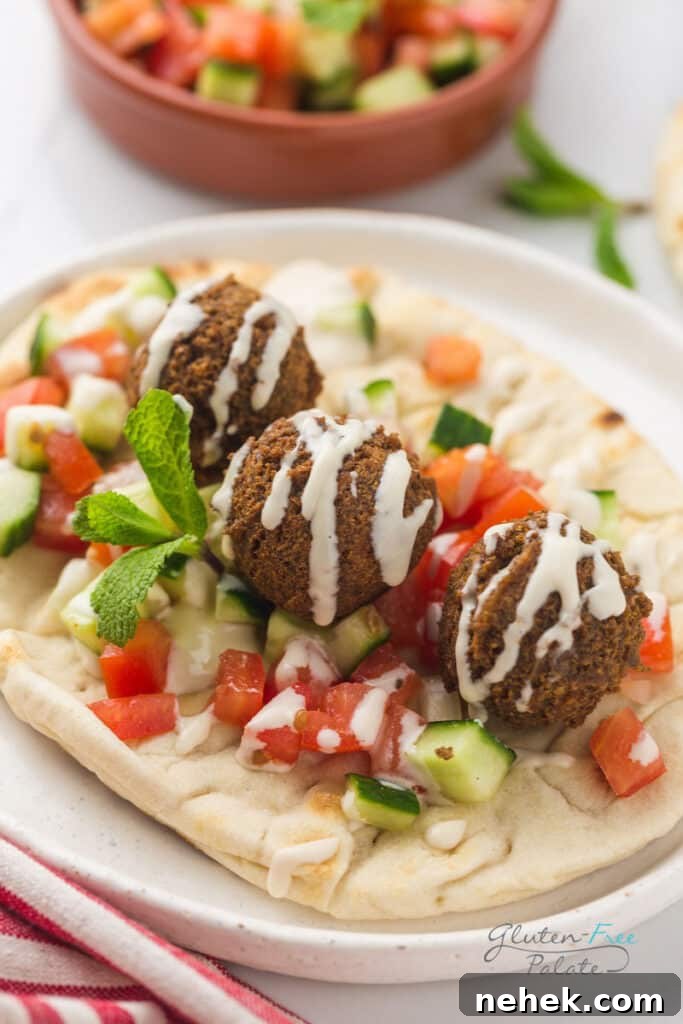 Three gluten-free falafels on a pita.