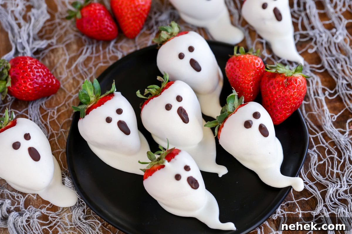 Juicy and sweet strawberry ghosts are spooky and delicious!! Here is a simple and quick tutorial on how to make these Boo-tiful treats. Dipped strawberry ghosts on a black plate