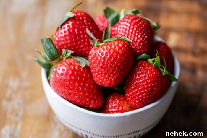 Strawberry Ghosts: Spooky Dessert Idea for Parties 2 strawberries on a plate