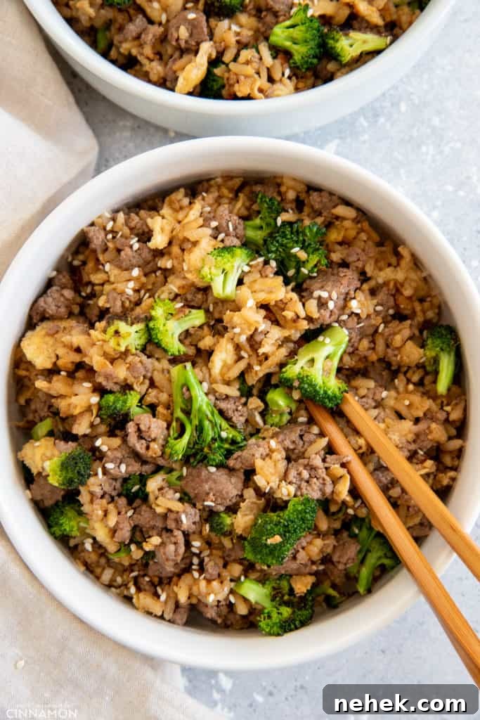 Ground Beef and Broccoli Fried Rice Recipe for Weeknight Dinner 9 two servings of Mongolian Beef and broccoli fried rice served in bowls with chopsticks