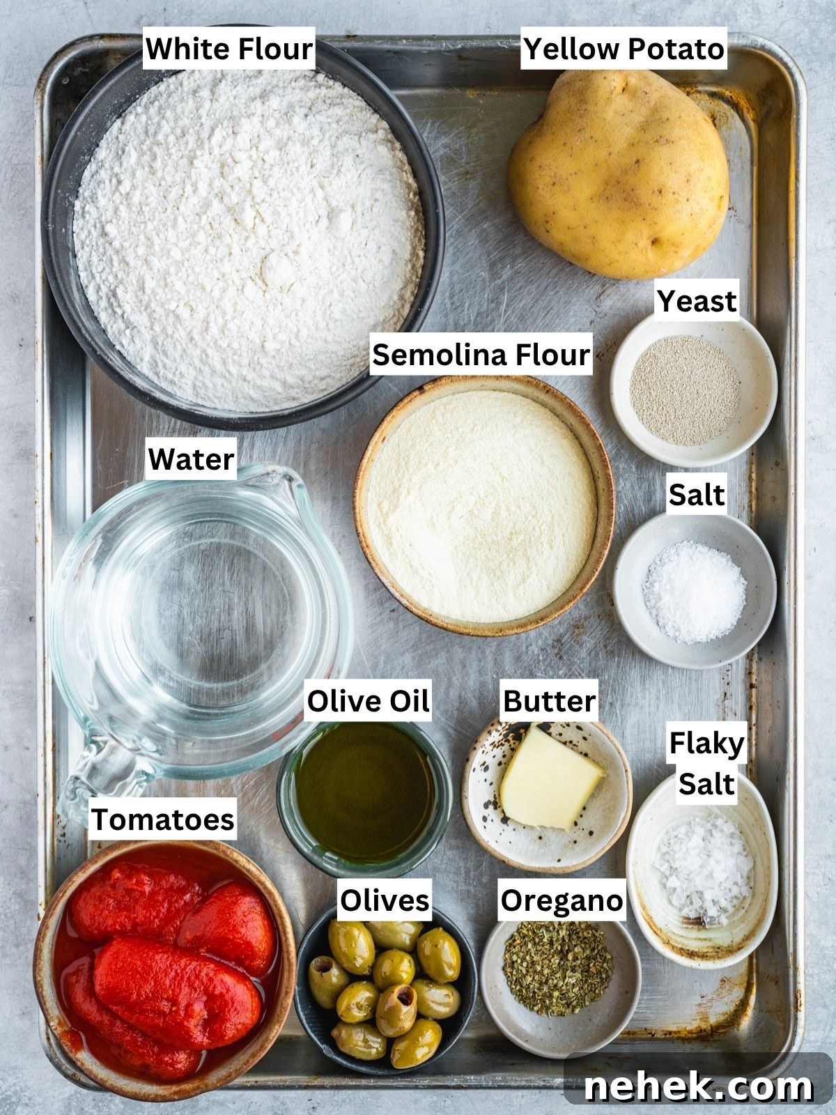 Focaccia Barese recipe ingredients with individual labels on a metal tray.