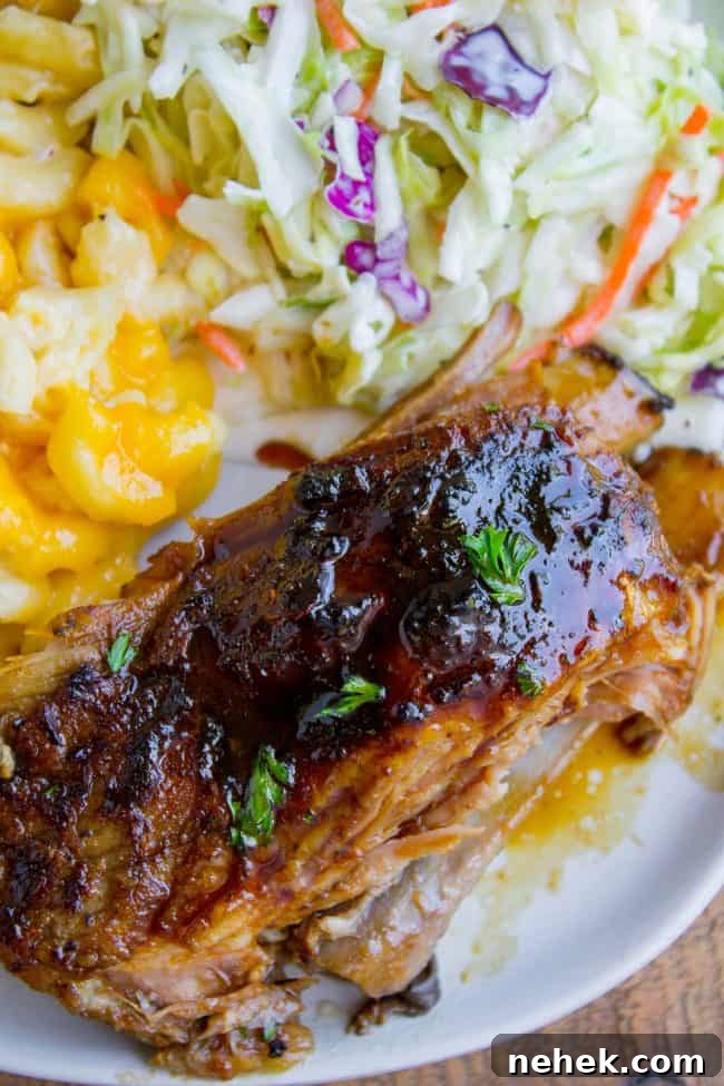 overhead of a chunk of pork rib on a plate with coleslaw