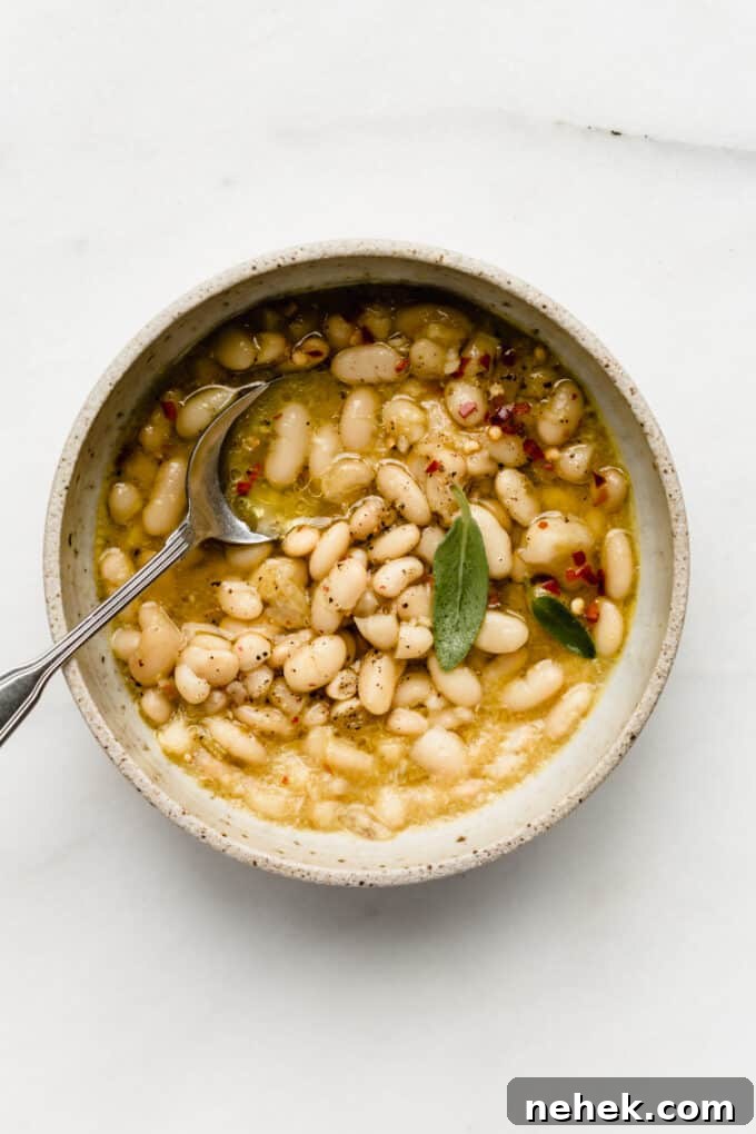 a bowl of cannelini beans in broth