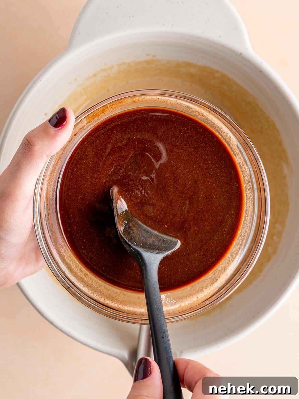 Fudgy Sourdough Discard Brownies You’ll Crave 5 Stirring melted chocolate and butter in a bowl with a spatula.
