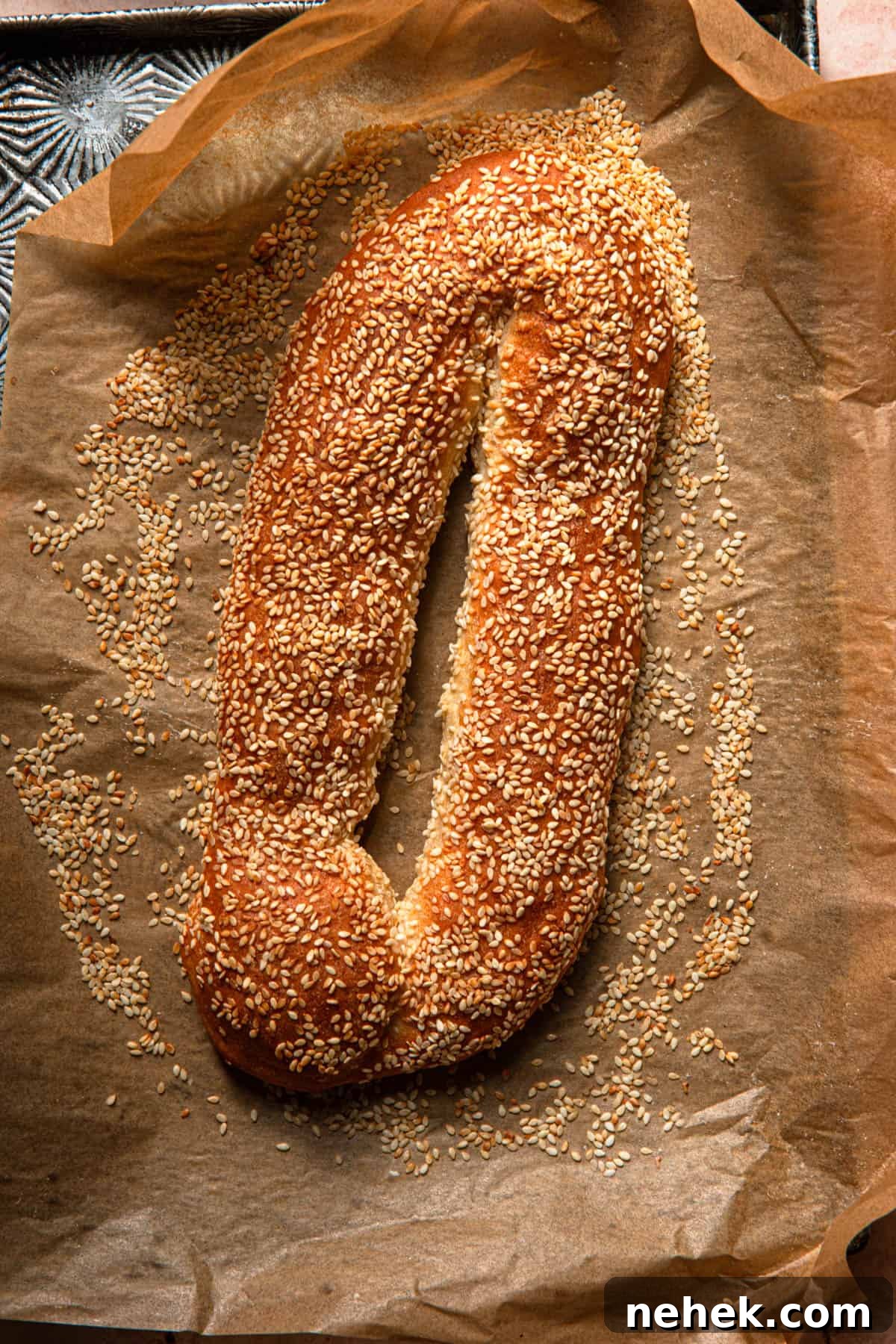 Light, Fluffy Jerusalem-Style Bagels: Authentic Recipe & Tips 10 sesame bagel on a tray.