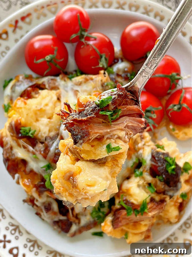 Smoky BBQ Mac and Cheese Recipe for Crowd-Pleasing Comfort 4 taking a bite of bbq mac and cheese