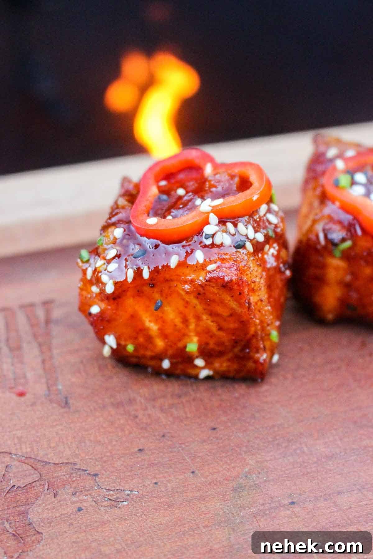 Crispy Bacon-Wrapped Salmon Bites with Maple Glaze 11 Bites topped with sliced peppers