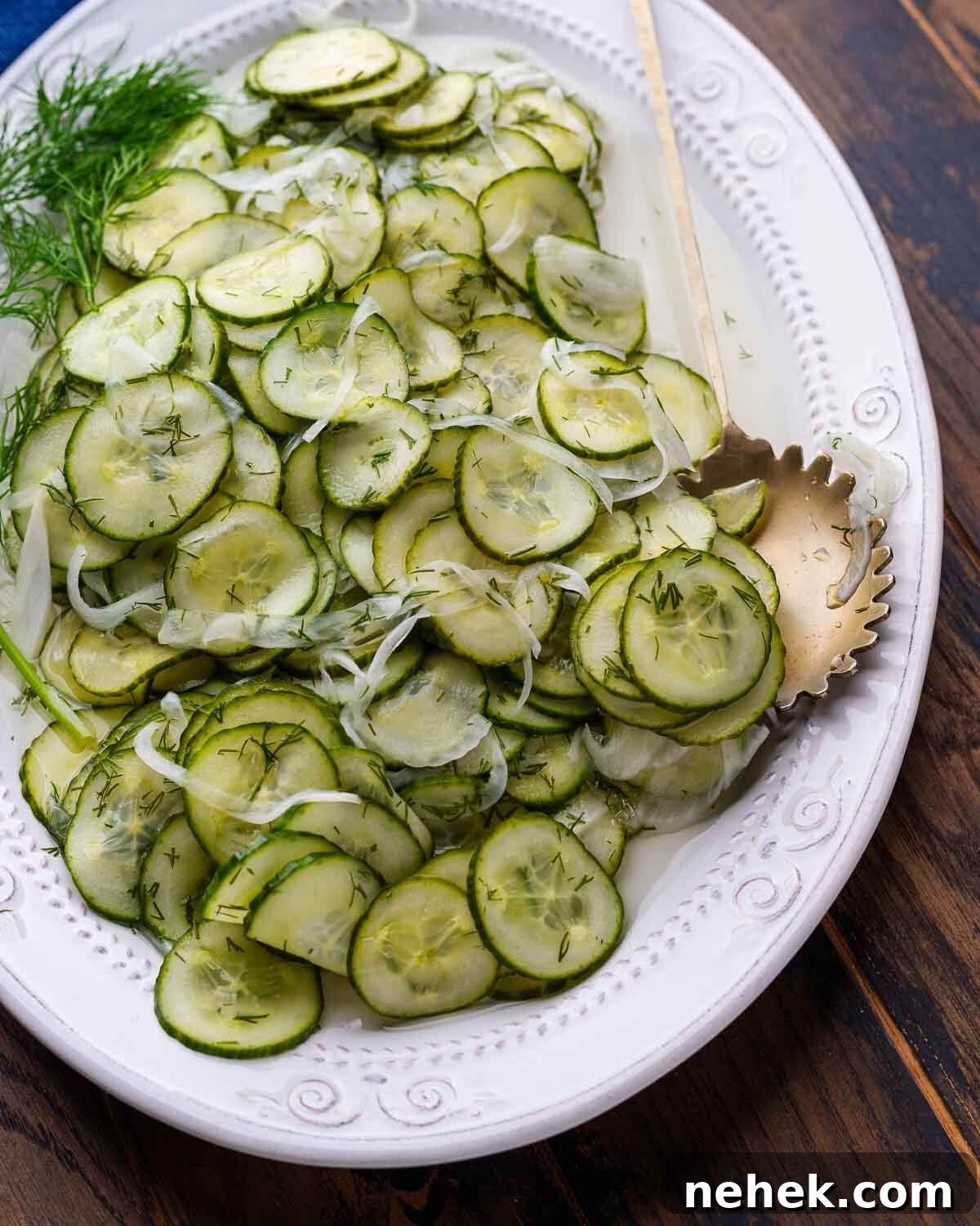 Refreshing Cucumber Salad Recipe with Herbs and Vinegar 6 Overhead shot of white platter with deli cucumber salad.